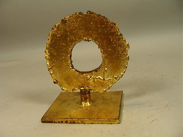 Mathais Goeritz Gilt Steel Sculpture. Circle for: Mathais Goeritz Gilt Steel Sculpture. Circle form on flat base. Initialed.-- Dimensions: H: 8 inches: W: 6.75 inches: D: 5.5 inches --- Condition (General): Very Good Condition. Please contact us with