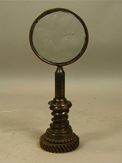 Feliciano Bejar Small Table Sculpture. 1981. Gla: Feliciano Bejar Small Table Sculpture. 1981. Glass disc top with gear base. Signed. 5 inch diameter. -- Dimensions: H: 12.5 inches: W: 5 inches --- Condition (General): Very Good Condition. Please con