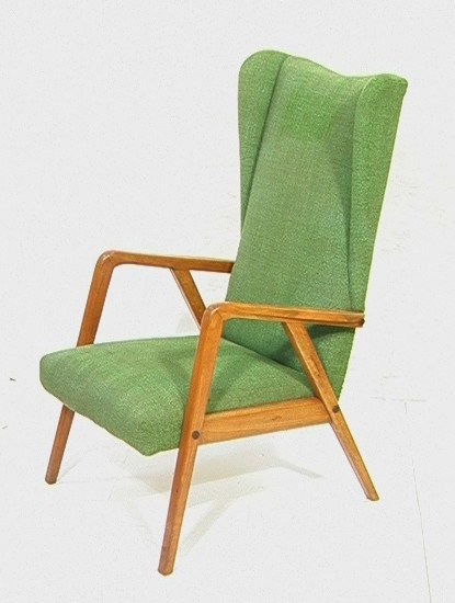 Early KNOLL Wing Chair. Wood Arms & Base. Origin: Early KNOLL Wing Chair. Wood Arms & Base. Original Upholstery. Tall Back. Early Label. -- Dimensions: H: 41.5 inches: W: 23 inches: D: 29 inches --- Condition (General): Hole to upholstery on back. On