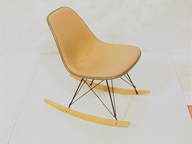 HERMAN MILLER Armless Rocker Rocking Chair. Birch: HERMAN MILLER Armless Rocker Rocking Chair. Birch Runners. Metal Frame Base. Tan Upholstery. Marked.-- Dimensions: H: 27.5 inches: W: 18 inches: D: 27.5 inches --- Condition (General): Very Good Condi