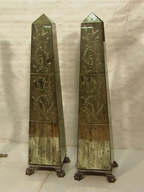 Pair Decorator Mirrored Floor Standing Obelisks.: Pair Decorator Mirrored Floor Standing Obelisks. Etched mirror design with wood feet. -- Dimensions: H: 71 inches: W: 18 inches --- Condition (General): One panel broken with loss. Two other panels wi