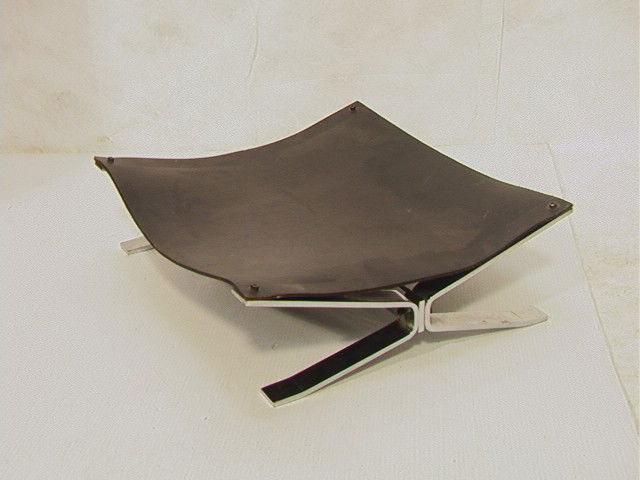 ALBRIZZI Chromed Steel and Leather Log Holder. De: ALBRIZZI Chromed Steel and Leather Log Holder. Designed by ALESSANDRO ALBRIZZI. Unmarked. Black Leather. -- Dimensions: H: 5.5 inches: W: 18 inches: D: 16 inches --- Condition (General): Metal needs t