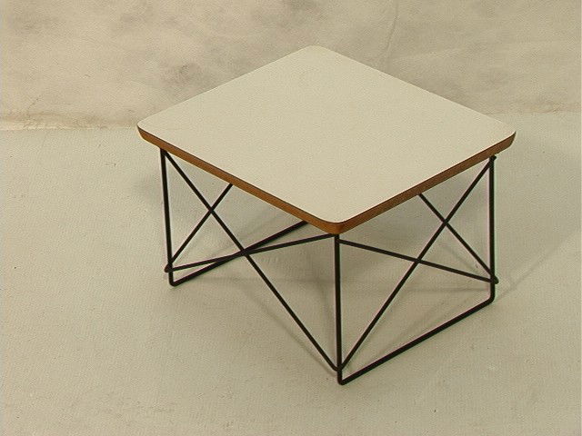 CHARLES EAMES for HERMAN MILLER LTR Table. White: CHARLES EAMES for HERMAN MILLER LTR Table. White Formica Table Top on black wire frame base. Round metal label.-- Dimensions: H: 10 inches: W: 15.5 inches: D: 13.25 inches --- Condition (General): Ver
