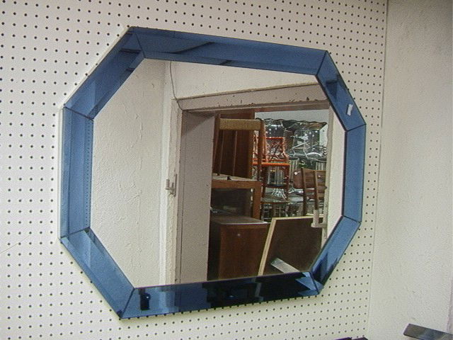 Art Deco Inspired Cobalt Blue Wall Mirror. Bevele: Art Deco Inspired Cobalt Blue Wall Mirror. Beveled Cobalt Framed Mirror. -- Dimensions: H: 28.25 inches: W: 36 inches --- Condition (General): Very Good Condition. Small crack to mirror on side edge.