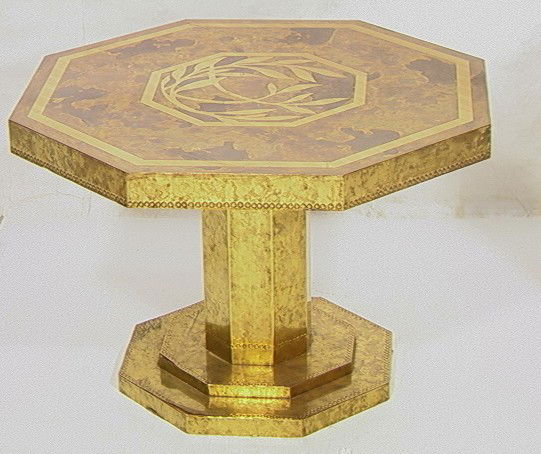 Decorator MASTERCRAFT Style Brass Laminate Table.: Decorator MASTERCRAFT Style Brass Laminate Table. Acid Etched Design. Octagonal Top on shaped brass base. -- Dimensions: H: 18 inches: W: 27 inches: D: 27 inches --- Condition (General): Some separati