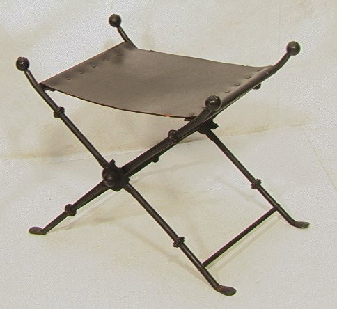 Decorator Iron Bench with Leather Seat. Folding ": Decorator Iron Bench with Leather Seat. Folding "X" frame with ball accents. -- Dimensions: H: 19 inches: W: 23.5 inches: D: 16 inches --- Condition (General): Wear and edge loss to leather. Paint dis