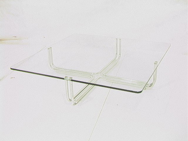 70's Modern Chrome and Glass Cocktail Table. Larg: 70's Modern Chrome and Glass Cocktail Table. Large 3/4" thick glass top with double chrome tube legs. Etched recess in table top for coffee table legs. -- Dimensions: H: 11.75 inches: W: 51 inches: D: