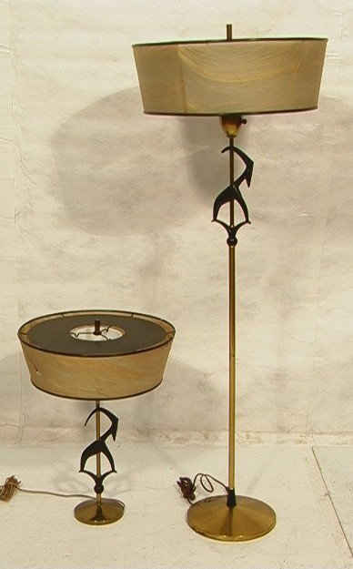 Pr Art Moderne Gazelle Lamps. One Floor Lamp and: Pr Art Moderne Gazelle Lamps. One Floor Lamp and One Table Lamp. Brass column and base with black metal gazelle motif. 2 PCS. -- Dimensions: H: 59 inches --- Condition (General): Original shade. Some 