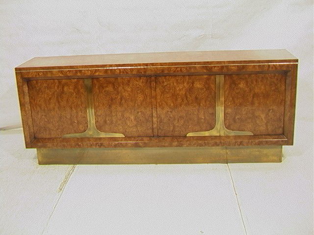 MASTERCRAFT Four Door Burl Wood Credenza. Brass: MASTERCRAFT Four Door Burl Wood Credenza. Brass trim, accents and foot plate. Interior shelf and drawers. -- Dimensions: H: 32.5 inches: D: 18 inches: L: 84 inches --- Condition (General): Missing cor
