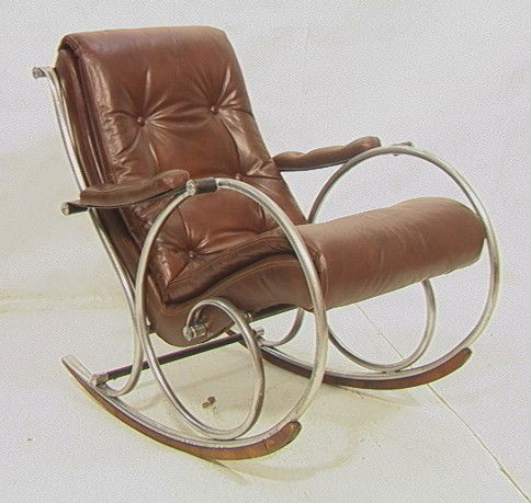 Mid Century Rocking Chair Rocker. Wine Leather Se: Mid Century Rocking Chair Rocker. Wine Leather Seat Cushion. Probably Woodard.-- Dimensions: H: 37 inches: W: 29 inches: D: 40 inches --- Condition (General): Big veneer chip to wood rocker. Seat is o
