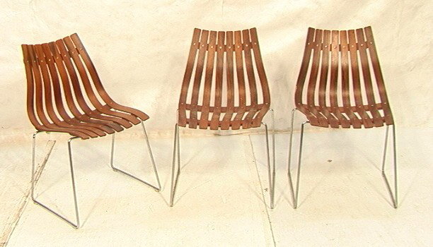 Set Three Hans Brattrud Stacking Chairs. Rosewoo: Set Three Hans Brattrud Stacking Chairs. Rosewood slats on chrome base.-- Dimensions: H: 33 inches: W: 19 inches: D: 25 inches --- Condition (General): Chips to veneer. One chair back is cracked. Plea