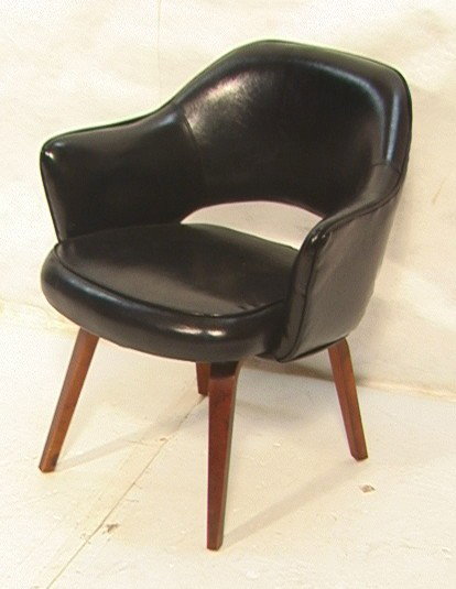 Knoll Arm Chair. Black vinyl with molded legs.: Knoll Arm Chair. Black vinyl with molded legs.-- Dimensions: H: 31 inches: W: 26 inches: D: 25 inches --- Condition (General): Very Good Condition. Please contact us with specific questions about cond