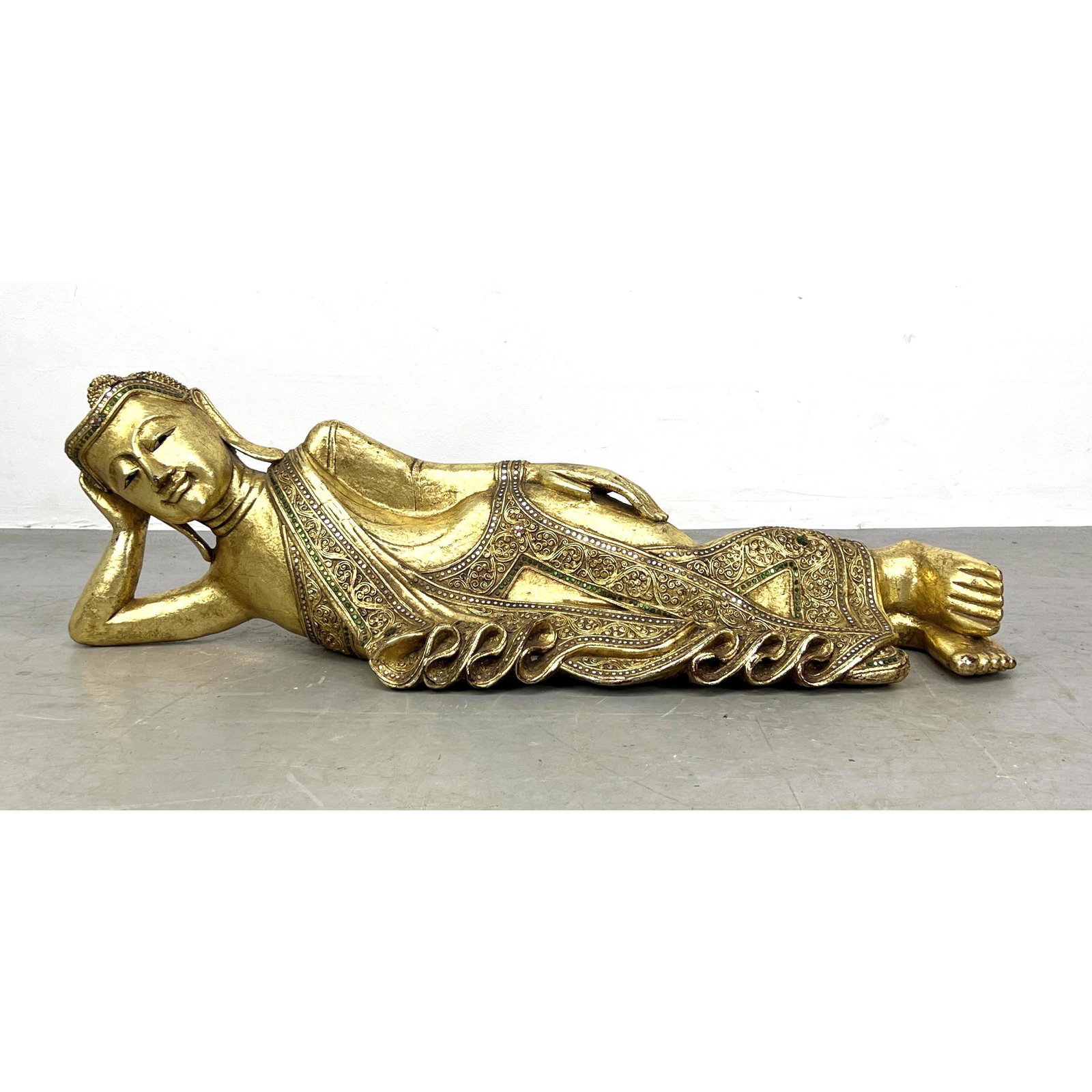 Carved Wood Gold Painted Reclining BUDDHA Sculpture. Inset mirrored trim decoration.: Carved Wood Gold Painted Reclining BUDDHA Sculpture. Inset mirrored trim decoration. Dimensions: H: 12 inches: W: 40 inches: D: 10 inches ---