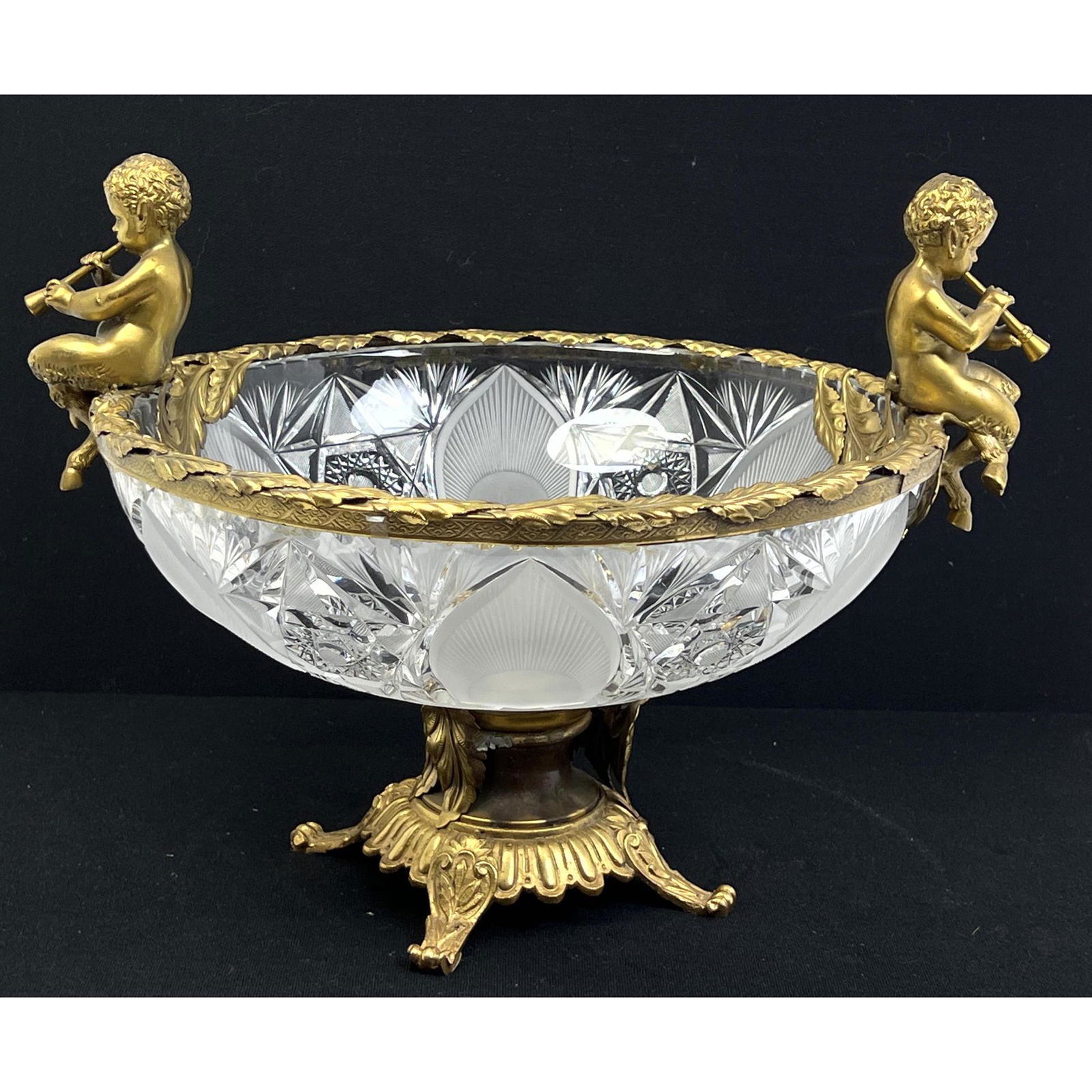 Gilt Brass Frame Cut Glass Bowl Compote. Footed Stand. Metal rim with figural cherubs blowing horns. (1 of 8)