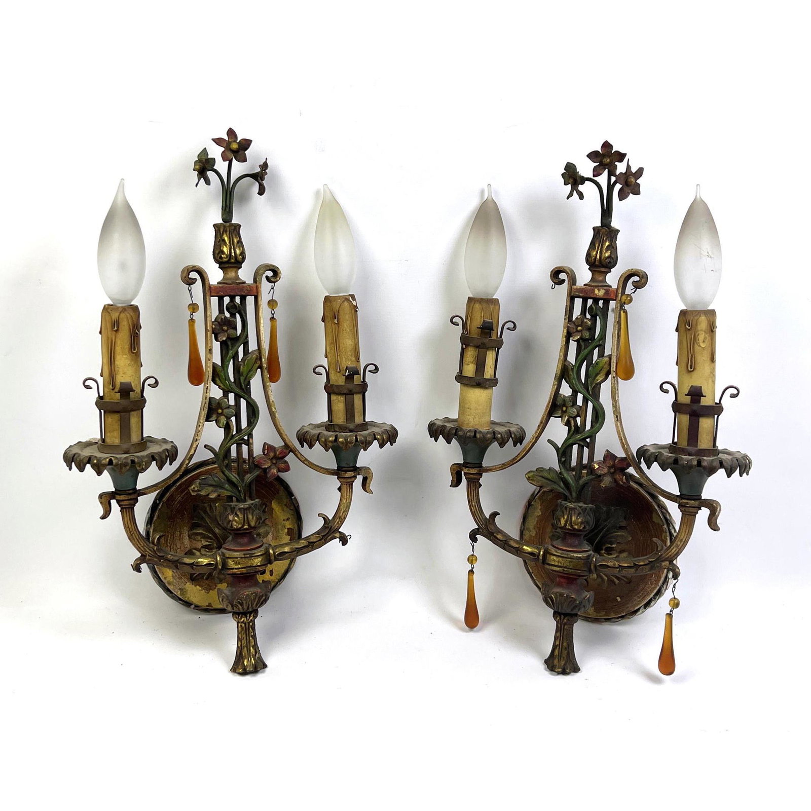 Pr Antique Polychrome Iron Two Arm Wall Sconces. Foliate details with tassels.: Pr Antique Polychrome Iron Two Arm Wall Sconces. Foliate details with tassels. Dimensions: H: 15.5 inches: W: 9.5 inches: D: 5 inches ---