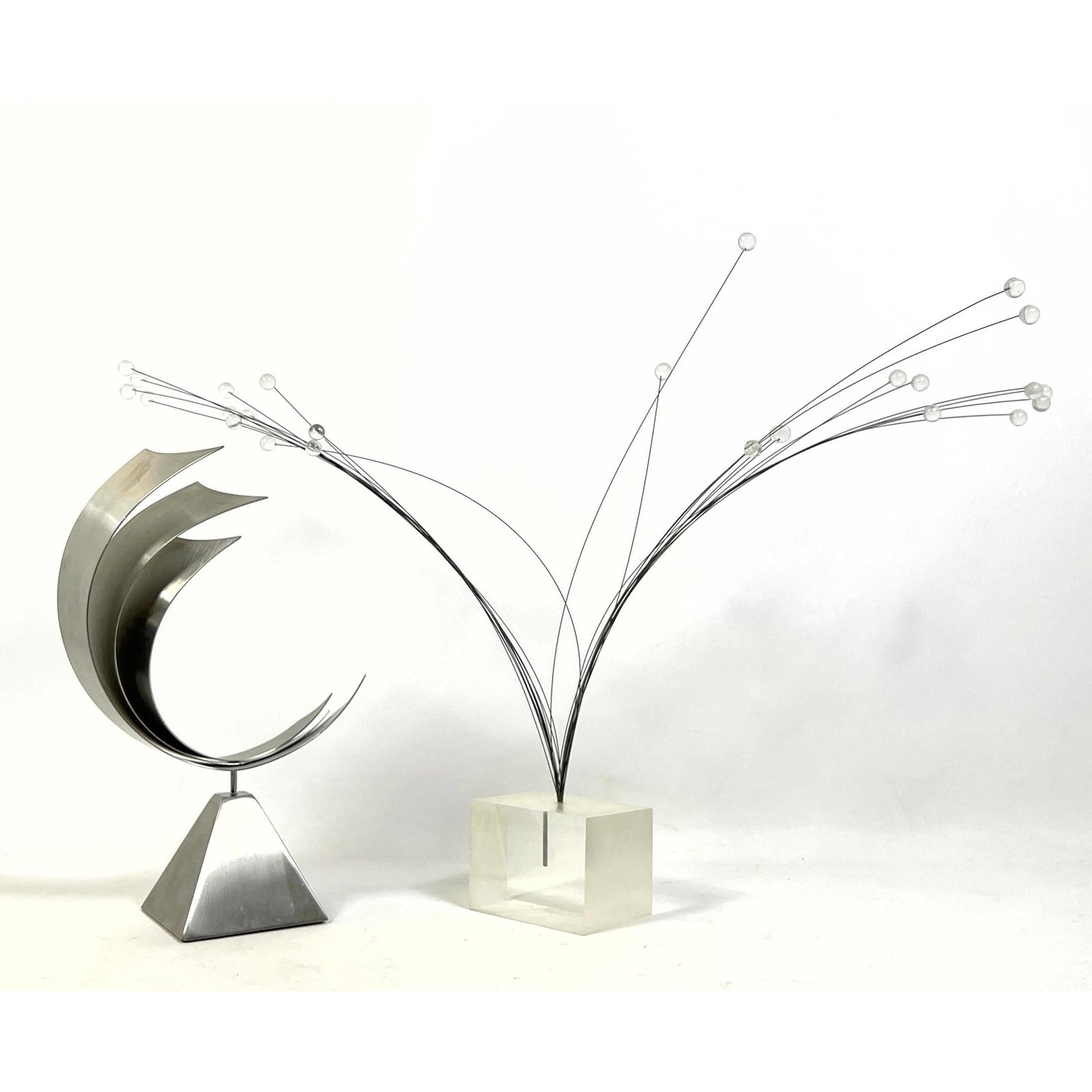 2pc Modernist Sculptures. 1) Steel Layered Wave Form on Pyramid Base. 2) Sprocket form on Lucite Cub (1 of 8)