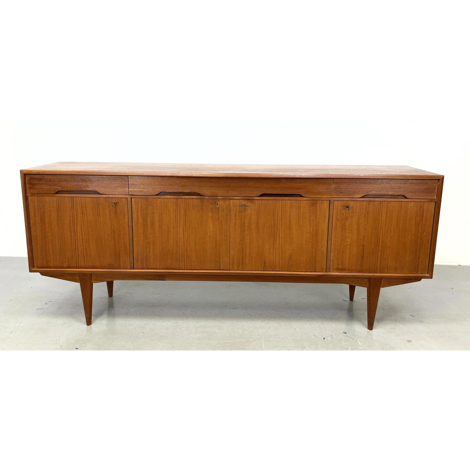 Danish Modern Teak Credenza Sideboard. Drawers and Doors. Raised on legs.: Danish Modern Teak Credenza Sideboard. Drawers and Doors. Raised on legs. Dimensions: H: 32.5 inches: W: 79.5 inches: D: 18 inches ---