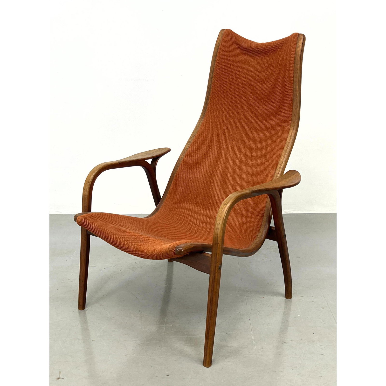 YNGVE EKSTROM Danish Teak Lounge Chair. Tall Back Lamino Lounge in Rust Orange Upholstery. Branded M: YNGVE EKSTROM Danish Teak Lounge Chair. Tall Back Lamino Lounge in Rust Orange Upholstery. Branded Mark: SWEDESE YNGVE ENGSTROM. Dimensions: H: 38.5 inches: W: 27.5 inches: D: 35 inches - Seat Height: