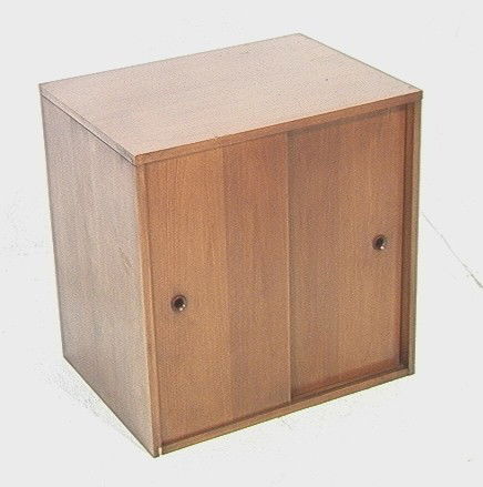 Paul McCobb Planner Group Cabinet with sliding Do: Paul McCobb Planner Group Cabinet with sliding Doors.-- Dimensions: H: 24 inches: W: 24 inches: D: 18.5 inches --- Condition (General): Mars to front corner. Veneer chips to corners. Minor scuffs. Ple
