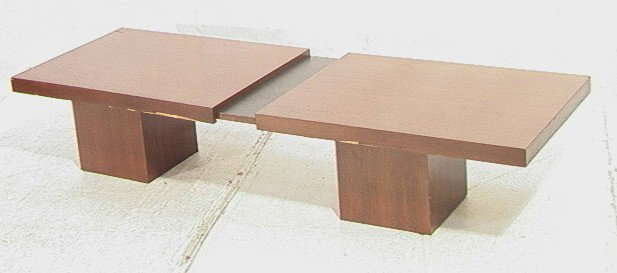 American Modern Walnut Coffee Cocktail Table. Pu: American Modern Walnut Coffee Cocktail Table. Pull Out Top extends to 93 inches-- Dimensions: H: 15 inches: W: 66.5 inches: D: 24 inches --- Condition (General): veneer losses to edges. Scratches and 