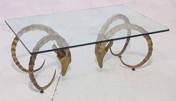 Decorator Brass and Glass Coffee Cocktail Table w: Decorator Brass and Glass Coffee Cocktail Table with Gazelle Heads for base. -- Dimensions: H: 18.5 inches: W: 28 inches: D: 48 inches --- Please contact us with specific questions about condition, no