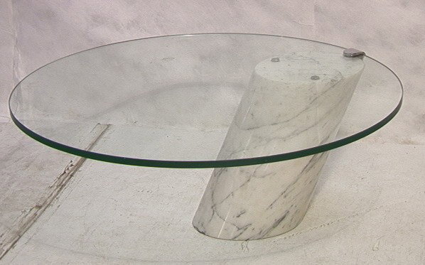 Springer Style Coffee Cocktail Table. Marble and: Springer Style Coffee Cocktail Table. Marble and Glass. Cantilever design. Unmarked.-- Dimensions: H: 17.5 inches: W: 44 inches --- Condition (General): Chip to glass. Please contact us with specific 