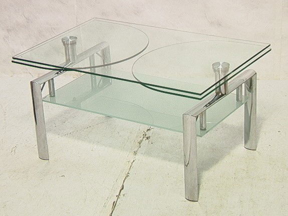 Contemporary Chrome Glass Coffee Cocktail Table.: Contemporary Chrome Glass Coffee Cocktail Table. Possibly Kaiser Newman. Has revolving top.-- Dimensions: H: 19 inches: W: 36 inches: L: 23 inches --- Condition (General): Side extensions measure 11.5