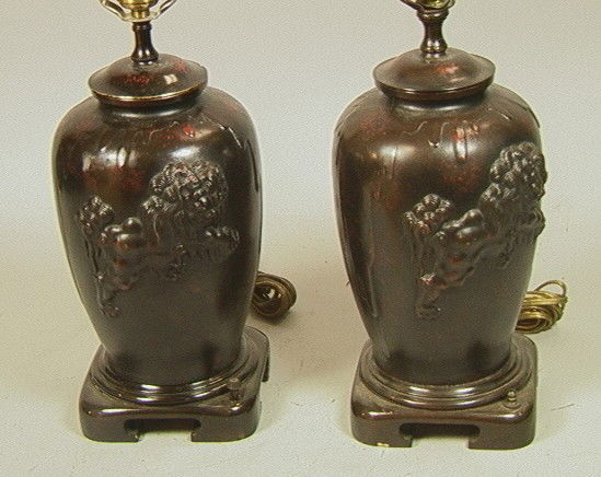 Pair Asian Bronze Table Lamps with Foo Dogs.: Pair Asian Bronze Table Lamps with Foo Dogs.-- Dimensions: H: 13 inches: W: 8 inches --- Please contact us with specific questions about condition, not visible in the photos. --- US Shipping charge: P