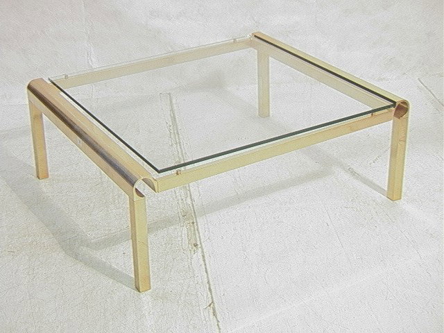 Modernist Aluminum and Glass Coffee Cocktail tabl: Modernist Aluminum and Glass Coffee Cocktail table. Brass color.-- Dimensions: H: 16 inches: W: 42.5 inches: D: 36 inches --- Condition (General): lots wear and scratches to metal. Please contact us w