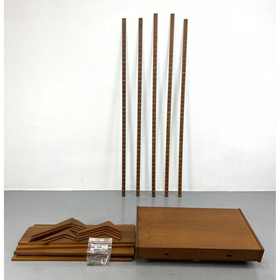 HG TEAK wall unit. 5 shelves with brackets. Desk. 5 uprights. Missing one bracket to hang desk. Chip (1 of 13)