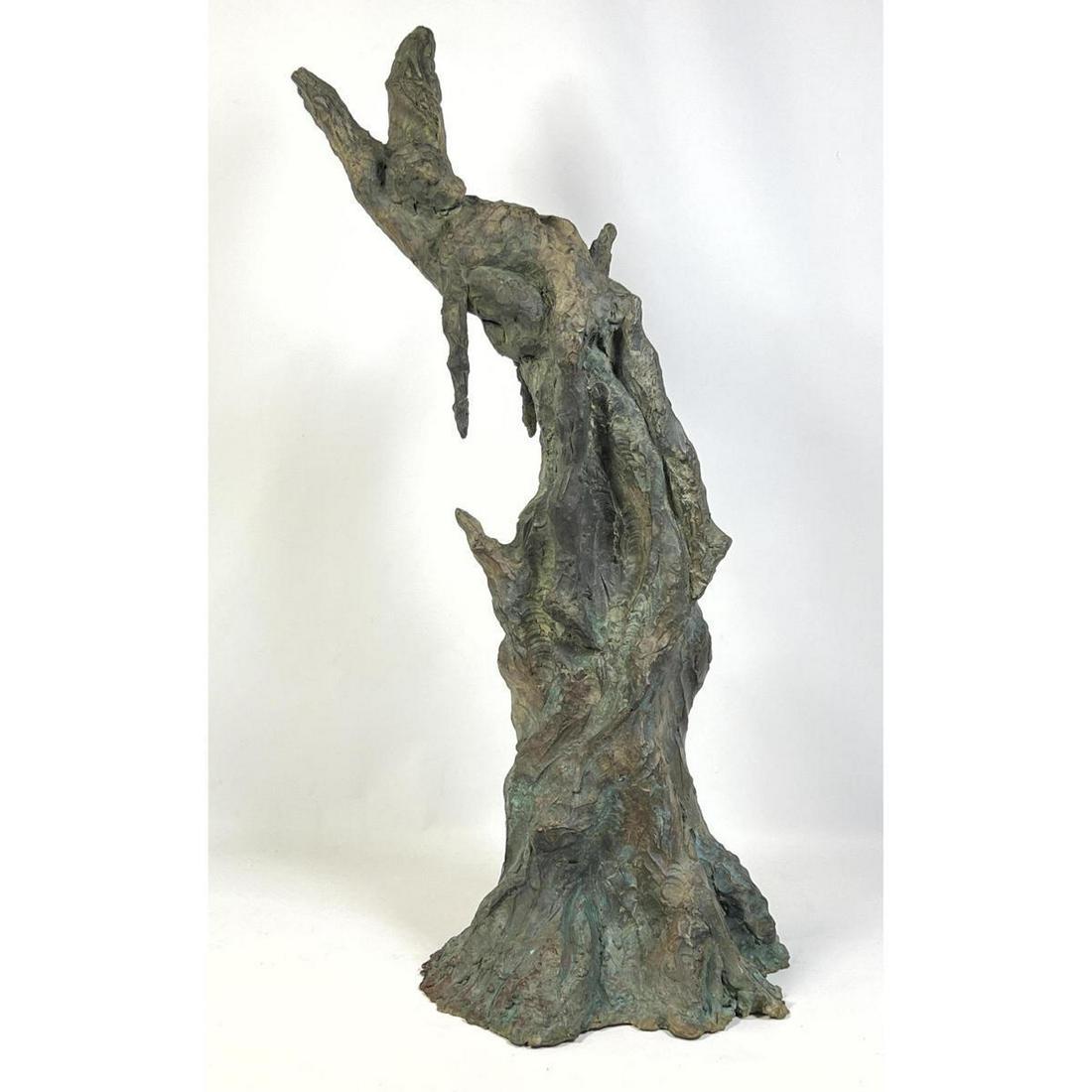 Bronze Modernist Sculpture. Abstract Modern. Reclining Figure on Tree Stump. Signed near base. Weigh: Bronze Modernist Sculpture. Abstract Modern. Reclining Figure on Tree Stump. Signed near base. Weighs 50 pounds. Comes with mounting stud and nut. Green patination. Dimensions: H: 32 inches: W: 12 inc