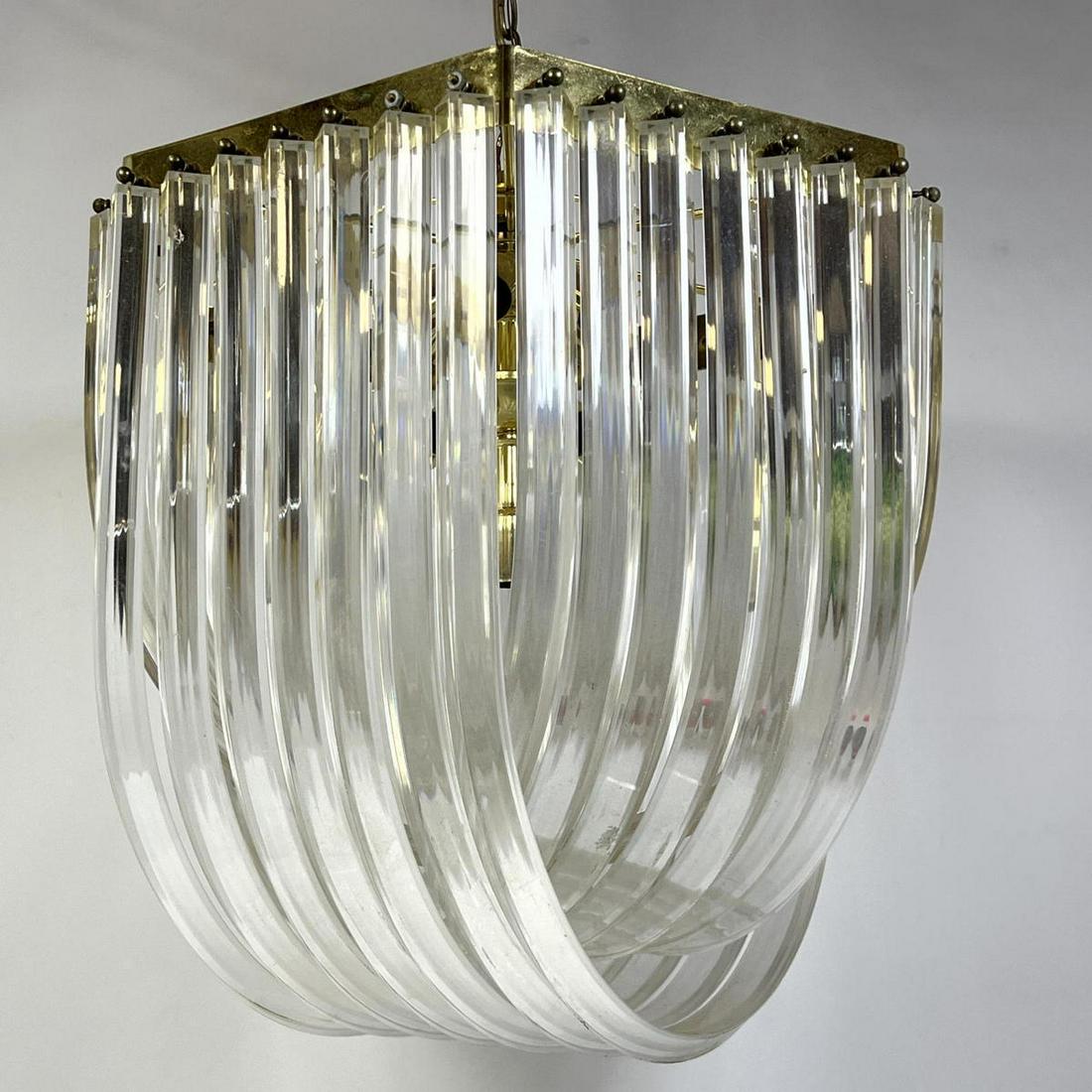 Camer style Modernist Chandelier. "U" Shaped Lucite Elements suspended from Gold Tone Armature. (1 of 8)