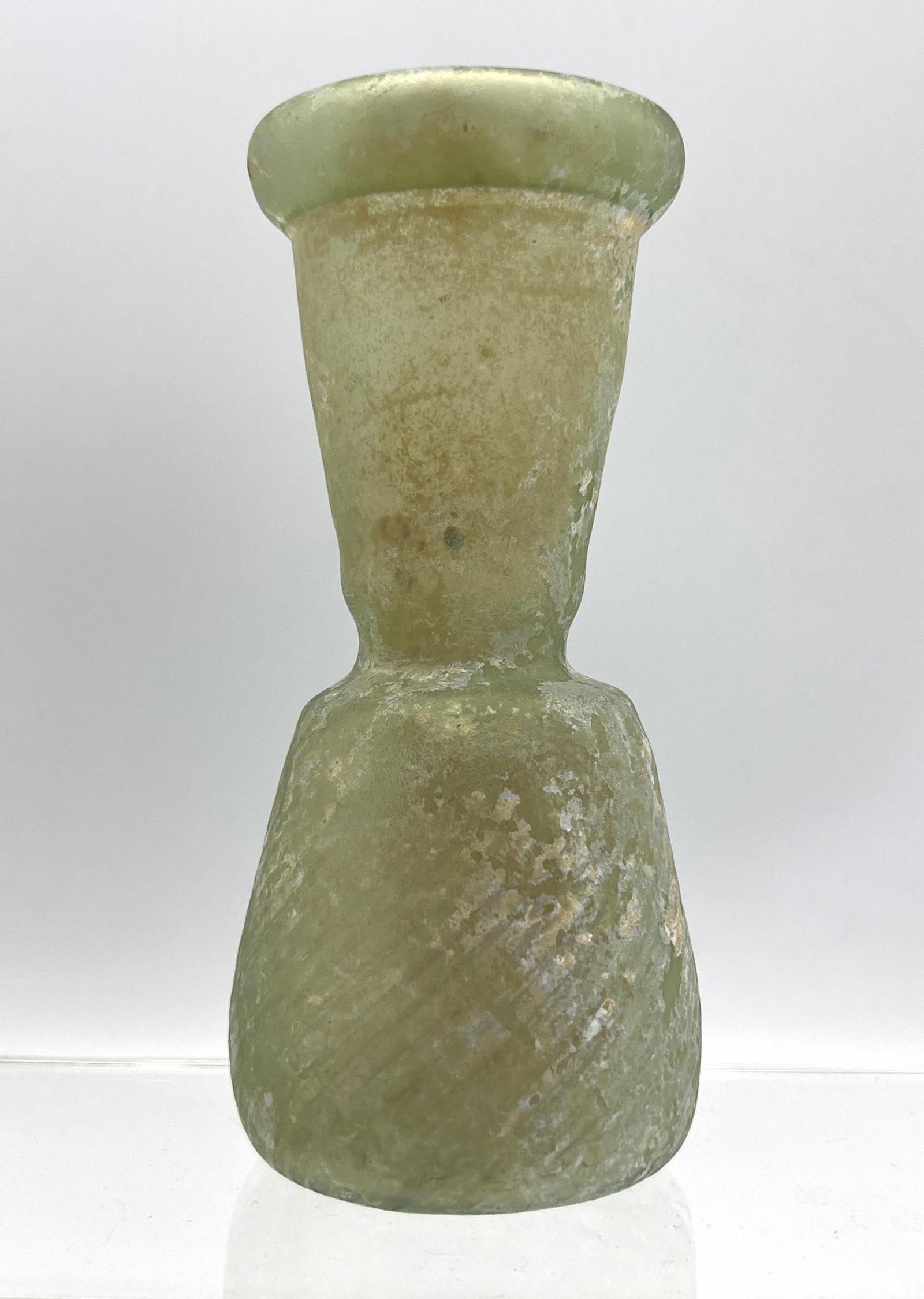 Pale green vessel Ancient Roman glass with ribbed body. (1 of 8)