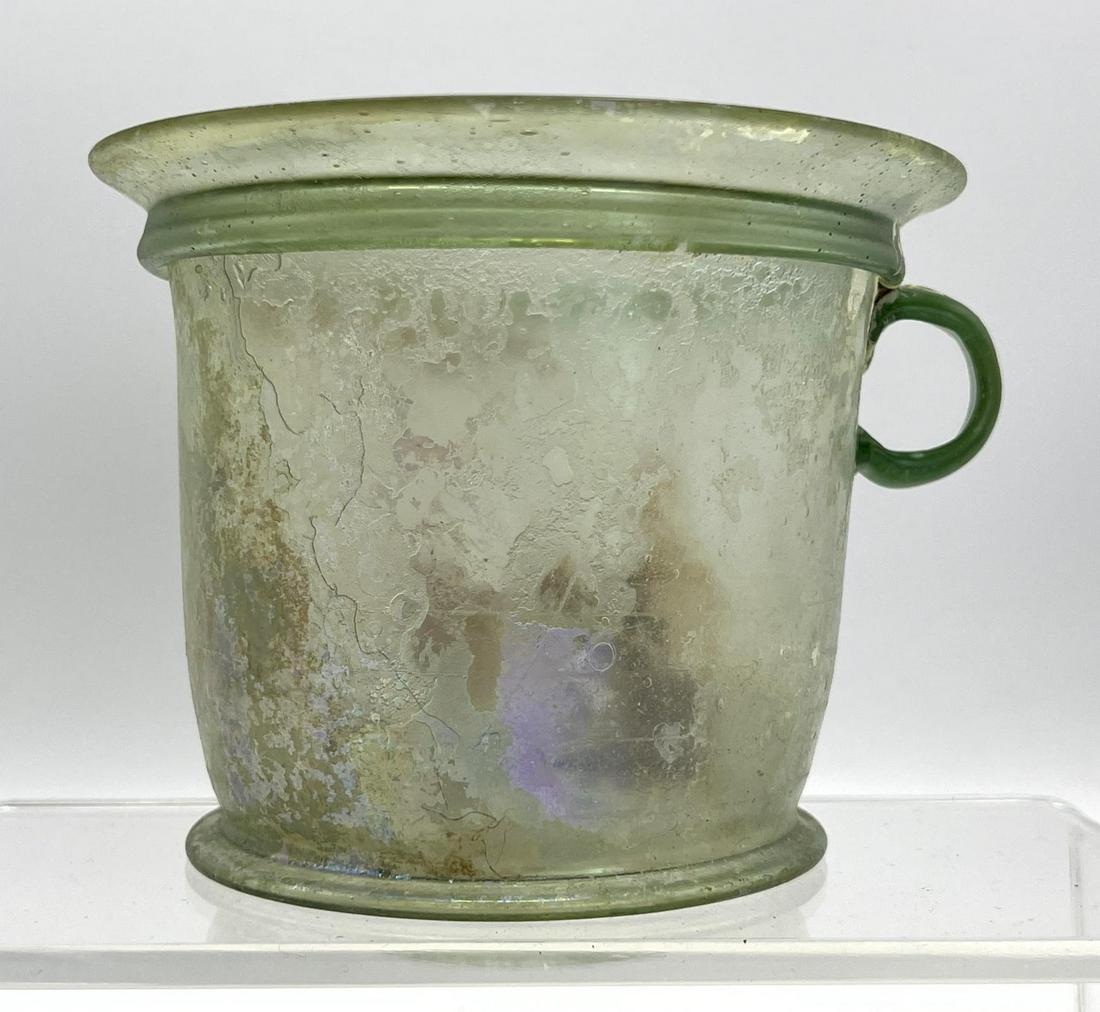 Ancient Handled flared green vessel Roman glass with iridescence. (1 of 11)