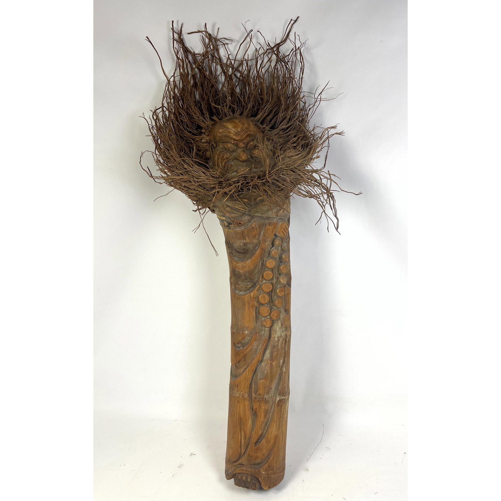 Bamboo Totem With Carved Head and Raffia, Straw Elements.: Bamboo Totem With Carved Head and Raffia, Straw Elements. Dimensions: H: 48 inches: W: 14 inches: D: 14 inches - Seat Height: 243 inches --- Uniques is closed for the holiday through January 3, 2023. 