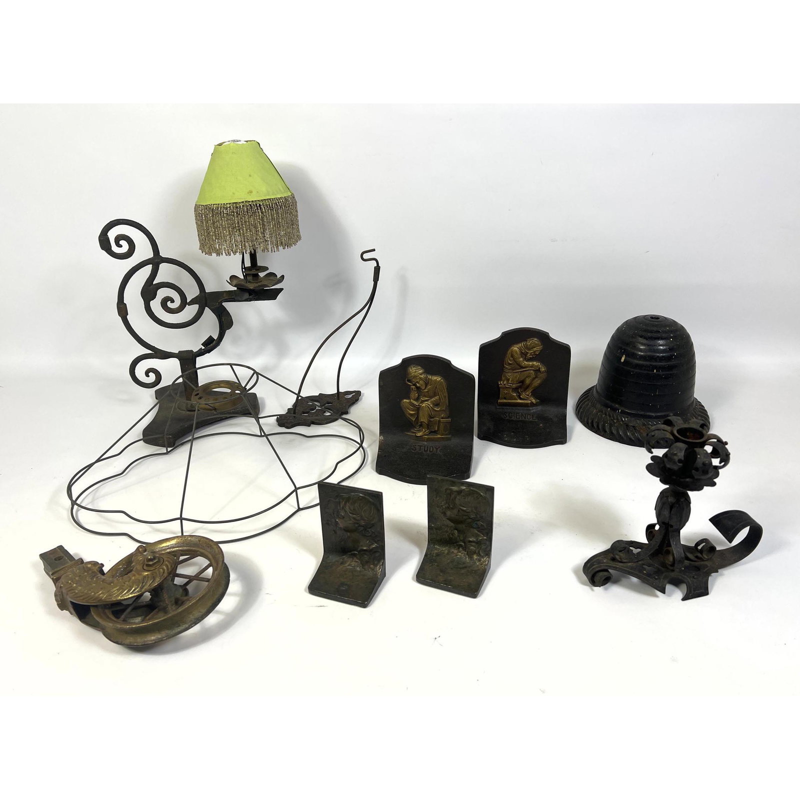 Metals Lot. Iron Bookends, Lanterns, Wheel.: Metals Lot. Iron Bookends, Lanterns, Wheel. --- Uniques is closed for the holiday through January 3, 2023. We will answer all inquiries on January 3 and 4 when we return. In person preview Wednesday J