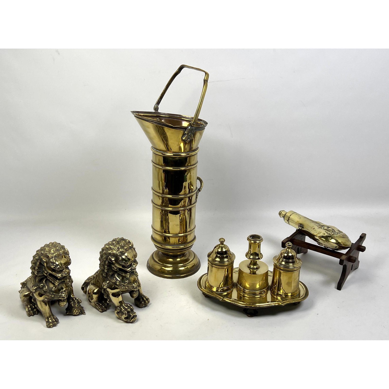 5pc Brass Desk Table Accessories. Pr Foo Dogs. Powder horn on stand. Bucket. Brass Tray with double: 5pc Brass Desk Table Accessories. Pr Foo Dogs. Powder horn on stand. Bucket. Brass Tray with double inkwells and candleholder. Dimensions: H: 15 inches: W: 8 inches: D: 6.5 inches --- Uniques is close