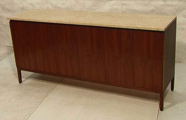 Paul McCobb Sideboard Dresser CALVIN Credenza. T: Paul McCobb Sideboard Dresser CALVIN Credenza. Trifold Door Front with Travertine Top. Interior fitted with Small and Large Drawers with Shaped Fronts. Finished back. Nice walnut grain. Calvin.-- Dime