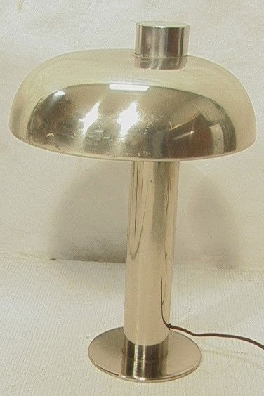 Modernist Chrome Table Lamp. Column form with Mu: Modernist Chrome Table Lamp. Column form with Mushroom Shade. Unmarked. -- Dimensions: H: 18.5 inches: D: 12 inches --- Condition (General): Some surface scratches. Missing cap for switch. Please cont