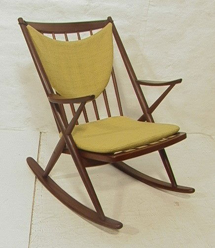 HANS WEGNER style Danish Teak Rocking Chair Rocke: HANS WEGNER style Danish Teak Rocking Chair Rocker. Loose Cushions. Unmarked.-- Dimensions: H: 34 inches: W: 26.5 inches: D: 34 inches --- Condition (General): Repairs to top crest rail on both ends.