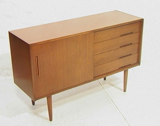Sweden Modern Credenza Cabinet. TROEDS DESIGN NIL: Sweden Modern Credenza Cabinet. TROEDS DESIGN NILS JONSSON. One sliding Door with 4 drawers, and shelf. Marked.-- Dimensions: H: 31 inches: W: 50 inches: D: 17 inches --- Condition (General): Repair t