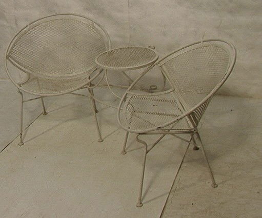Modernist Iron Tet a Tet. Chairs with table. Wh: Modernist Iron Tet a Tet. Chairs with table. White mesh iron-- Dimensions: H: 29.5 inches: W: 69 inches: D: 35 inches --- Condition (General): Very Good Condition. Please contact us with specific ques