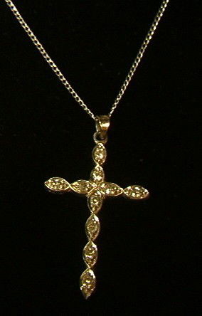 14K Gold Diamond Cross Pendant on 14K Gold Chain.: 14K Gold Diamond Cross Pendant on 14K Gold Chain. -- Dimensions: H: 1.5 inches: W: .75 inches--- Weight: 1.5 DWT --- Please contact us with specific questions about condition, not visible in the photo