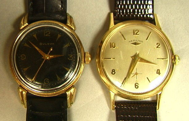 2pcs Men's Watches ... 14K Gold Hamilton & Bulova: 2pcs Watches. 14K Gold Hamilton Mans Watch. Bulova Mans watch with black face.-- Dimensions: --- Please contact us with specific questions about condition, not visible in the photos. --- US Shipping c