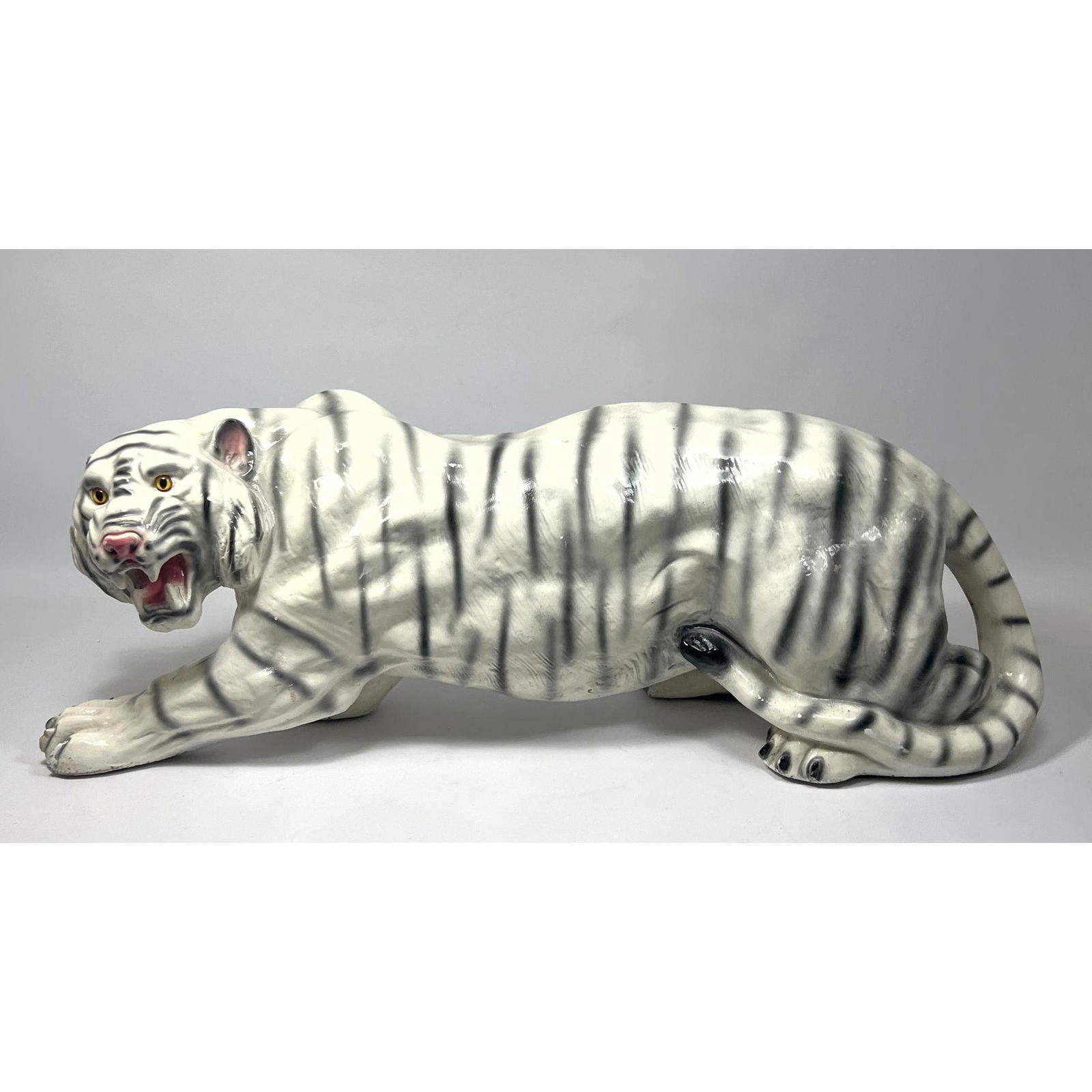 Large Painted Plaster Figural Crouching Tiger Sculpture.: Large Painted Plaster Figural Crouching Tiger Sculpture. Dimensions: H: 12 inches: W: 33.5 inches: D: 10 inches --- We offer curbside delivery to NYC, Manhattan, Close Brooklyn, Hoboken about a week a