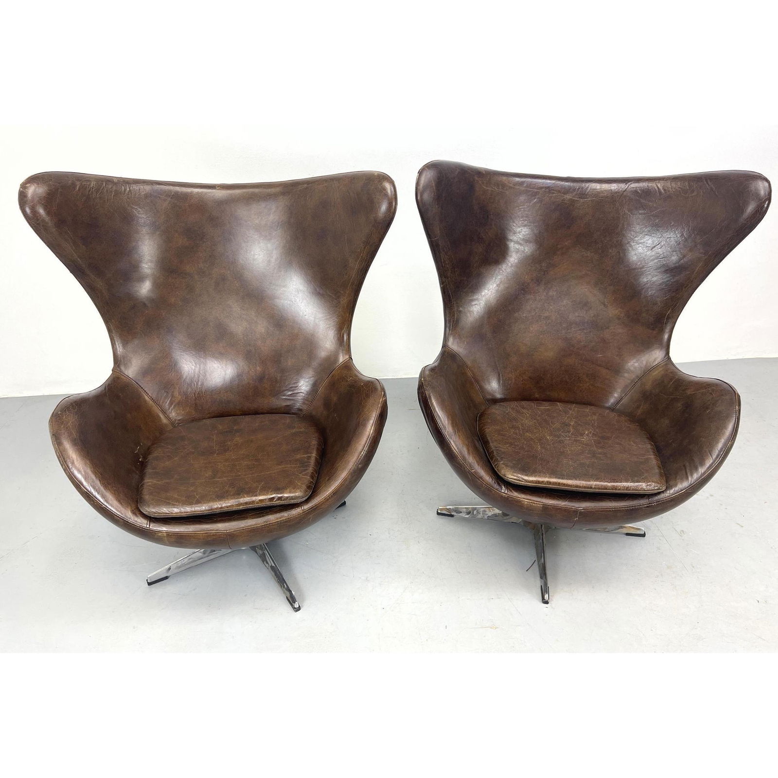 Pair Contemporary brown leather egg chairs. Unmarked. (1 of 16)