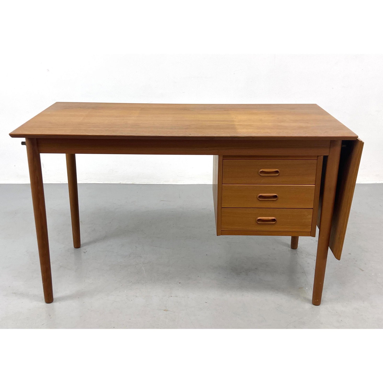 Arne Vodder for H. Sigh and Sons Teak Desk with flip up extension.: Arne Vodder for H. Sigh and Sons Teak Desk with flip up extension. Dimensions: H: 28 inches: W: 47.5 inches: D: 23.5 inches --- We offer curbside delivery to NYC, Manhattan, Close Brooklyn, Hoboken ab