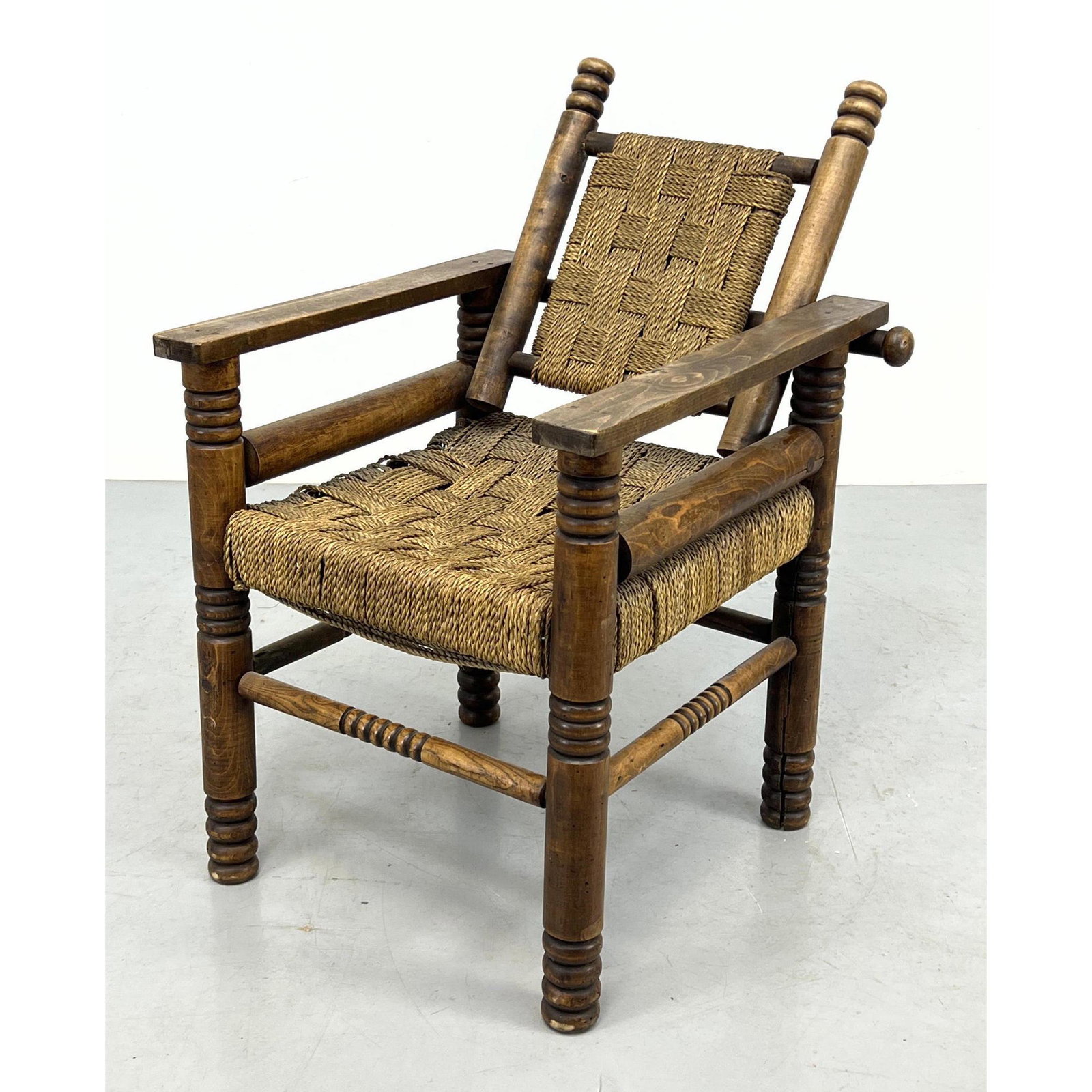 French Oak and cord Lounge Chair by Charles dudouyt: French Oak and cord Lounge Chair by Charles dudouyt Dimensions: H: 33 inches: W: 24 inches: D: 28 inches --- -- We offer curbside delivery to NYC, Manhattan, Close Brooklyn, Hoboken about a week after