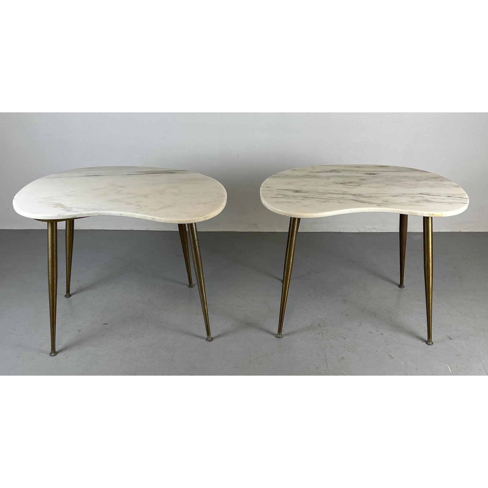 Pair Italian Style Marble Top side Tables. Kidney shaped marble top side tables: Pair Italian Style Marble Top side Tables. Kidney shaped marble top side tables Dimensions: H: 24 inches: W: 32 inches: D: 21 inches --- -- We offer curbside delivery to NYC, Manhattan, Close Brooklyn