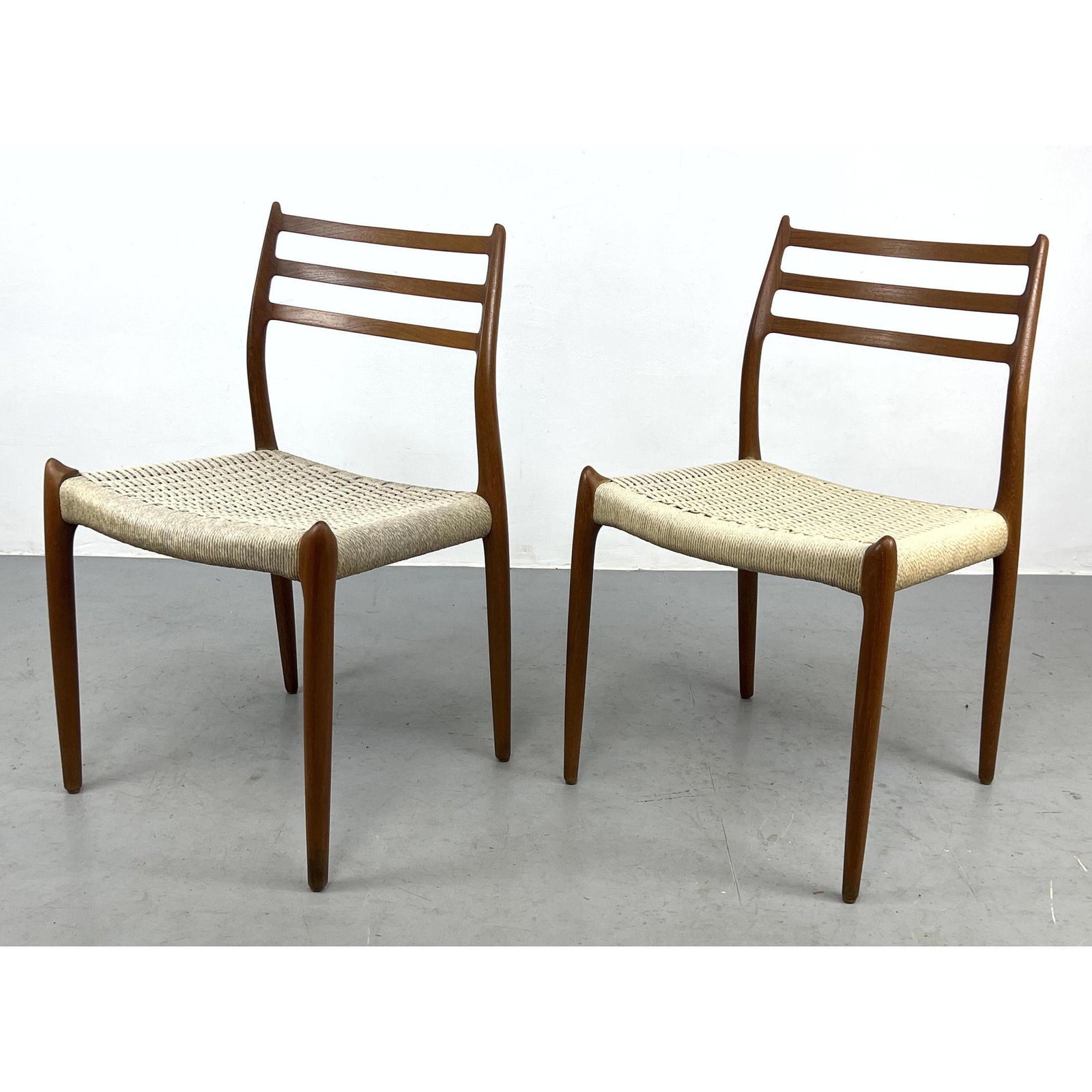 Pr NIELS MOLLER Teak Chairs with Woven Fiber Seats. Two Side Chairs. J.L. Moller. Denmark. (1 of 7)